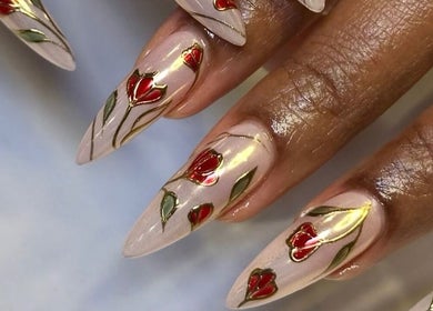 Elegant floral nail art at Noire the nail bar orlando, Orlando, Florida, US. Stylish red and green accents.