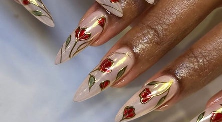 Elegant floral nail art at Noire the nail bar orlando, Orlando, Florida, US. Stylish red and green accents.