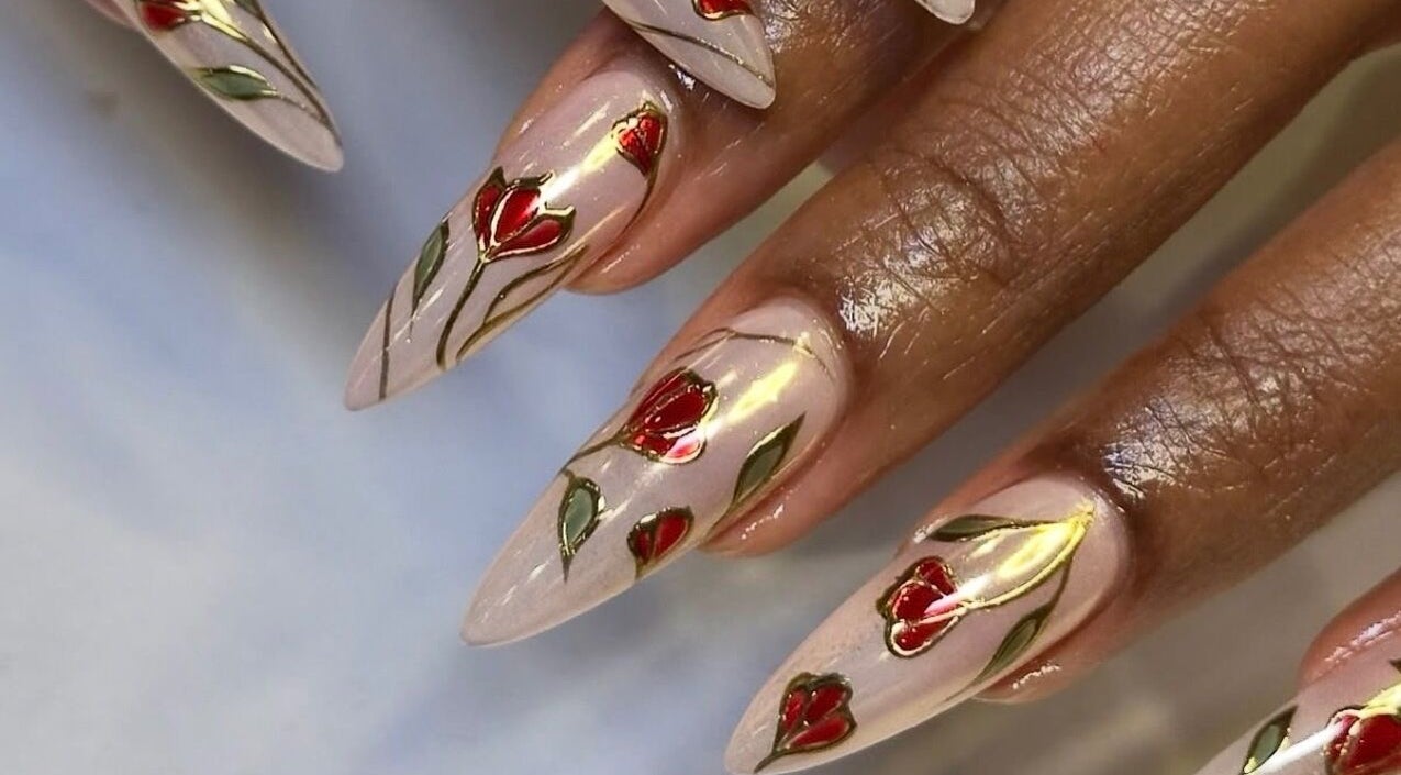 Elegant floral nail art at Noire the nail bar orlando, Orlando, Florida, US. Stylish red and green accents.