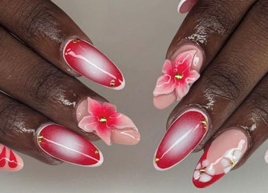 Intricate pink and red floral nail art at Noire the nail bar orlando, located in Orlando, Florida, US.