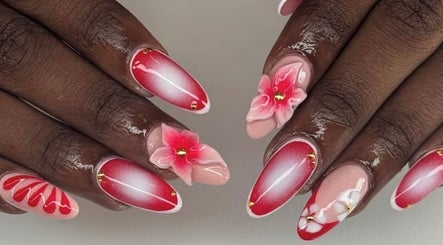 Intricate pink and red floral nail art at Noire the nail bar orlando, located in Orlando, Florida, US.