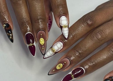 Elegant nail art with gold accents at Noire the nail bar orlando, Orlando, Florida, US.