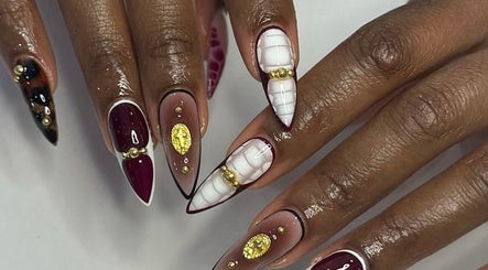 Elegant nail art with gold accents at Noire the nail bar orlando, Orlando, Florida, US.