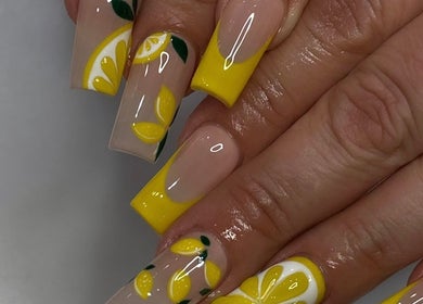 Bright lemon-themed nail art at Noire the Nail Bar Orlando, showcasing vibrant yellow and nude design in Orlando, Florida, US.