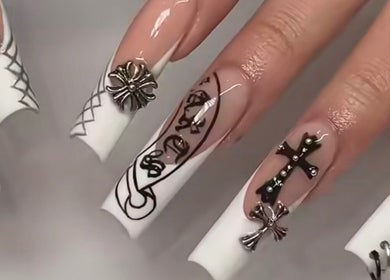 Ornate black and white nail art with metallic designs at Noire the nail bar orlando, Orlando, Florida, US.