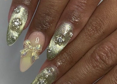 Elegant glittery nail art with star accents at Noire the nail bar orlando, Orlando, Florida, US.