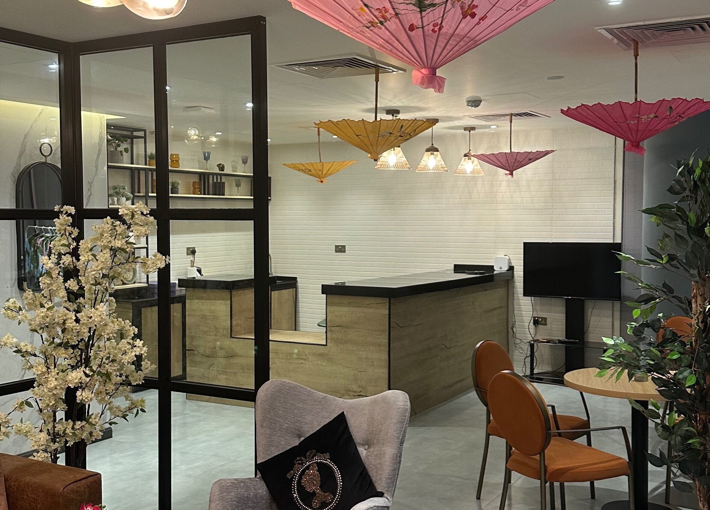 Elegant interior of Bel Fiore Ladies Salon, Abu Dhabi with modern seating and floral decor.