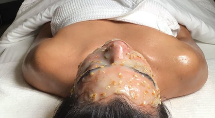 Relaxing facial treatment at The Glow Box Aesthetics in West Allis, Wisconsin, US, featuring exfoliating mask.