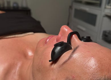 Relaxed client enjoying a treatment at The Glow Box Aesthetics, West Allis, Wisconsin, US.