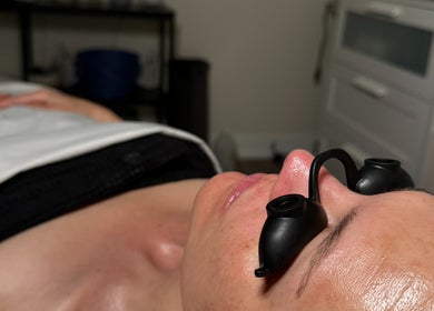 A relaxing facial session at The Glow Box Aesthetics, West Allis, Wisconsin, US with protective goggles.