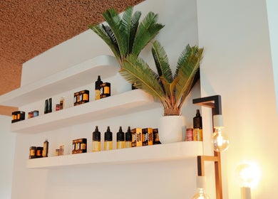 Modern shelves with products at Icon Barbershop Amsterdam, Noord-Holland, NL, enhance decor.
