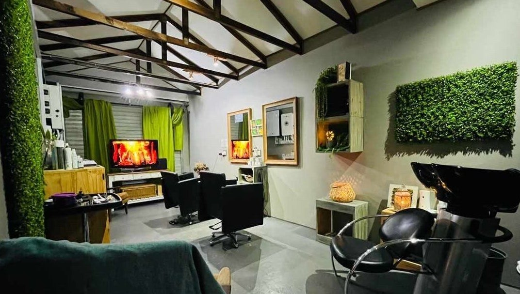 Chic interior of Authentic Cutz By Bernice in Gqeberha, Eastern Cape, ZA featuring elegant chairs and green decor.