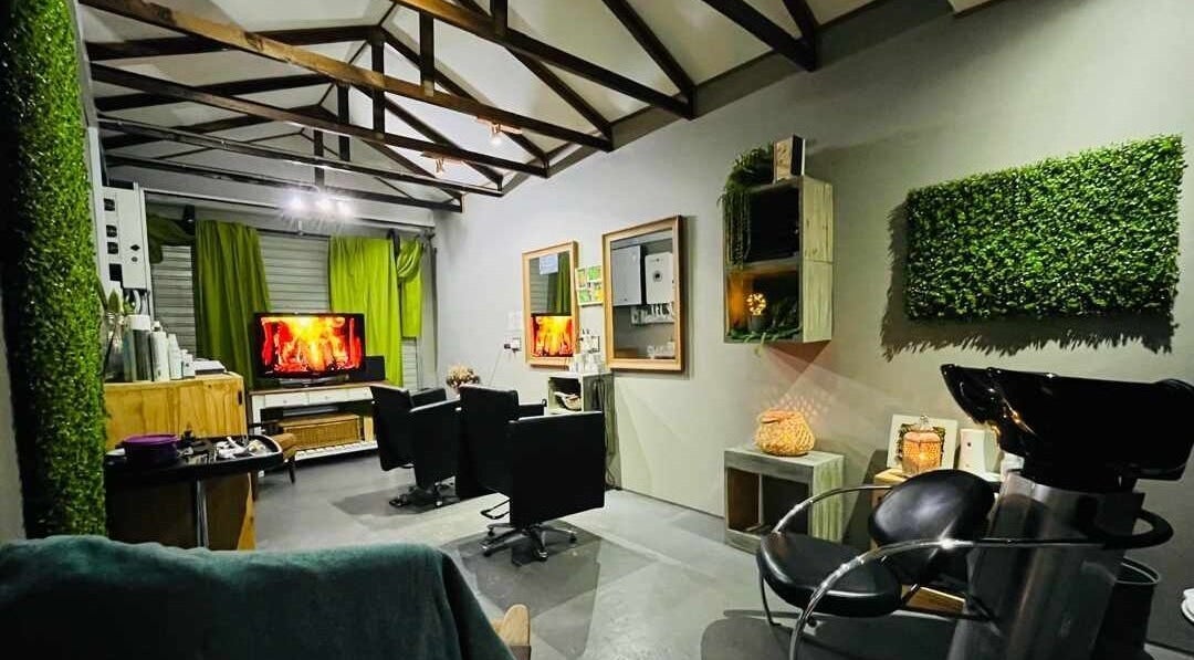 Chic interior of Authentic Cutz By Bernice in Gqeberha, Eastern Cape, ZA featuring elegant chairs and green decor.