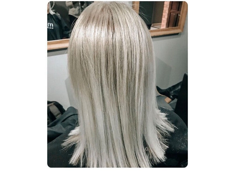 Elegant silver hair styled at Authentic Cutz By Bernice, Gqeberha, Eastern Cape, ZA, showcasing sleek look.