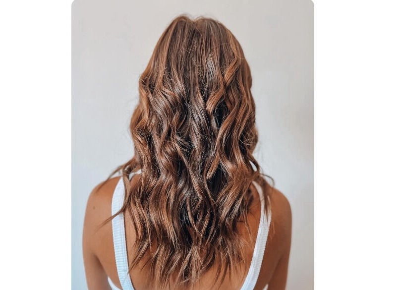 Elegant curly hairstyle at Authentic Cutz By Bernice, Gqeberha, Eastern Cape, ZA, showcasing professional styling.