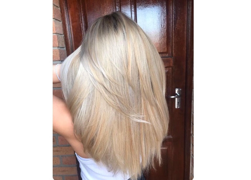 Lustrous blonde hair styled at Authentic Cutz By Bernice in Gqeberha, Eastern Cape, ZA.