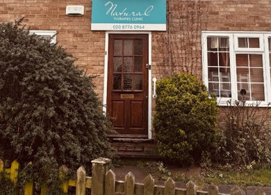 Front view of Alma Wellness, West Wickham, England, welcoming entrance with greenery.