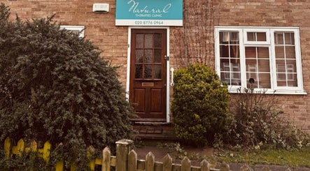 Front view of Alma Wellness, West Wickham, England, welcoming entrance with greenery.