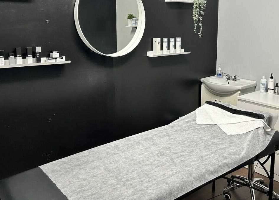 Chic treatment room at Selfish Beauty Lounge in Vaughan, Ontario, CA featuring a cozy bed and stylish decor.
