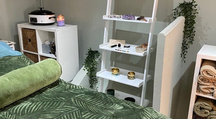 Relaxing treatment room at Paula Aesthetics & Holistics, North Houghton, England, GB with soothing decor.