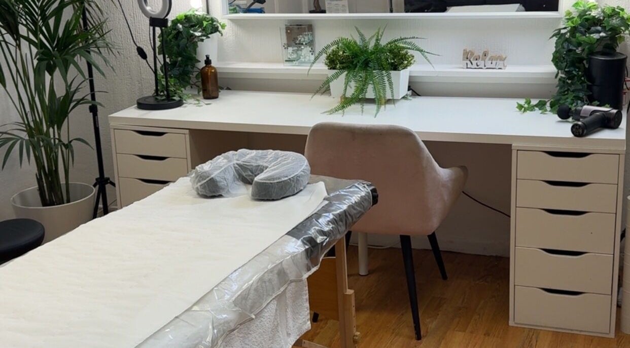 Luxury treatment room at Seasonal Glo' in Birmingham, England, GB, featuring modern decor and soothing ambiance.