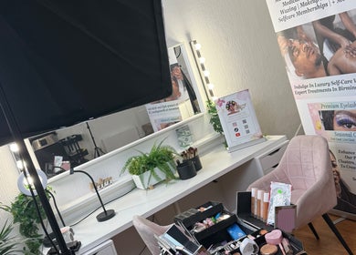 Makeup station at Seasonal Glo' in Birmingham, England, GB with plants and promotional display.