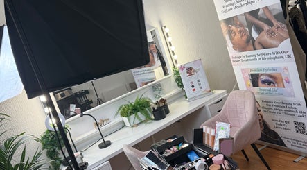 Makeup station at Seasonal Glo' in Birmingham, England, GB with plants and promotional display.