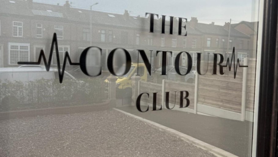 Window with The Contour Club Mcr logo in Bolton, England, GB.