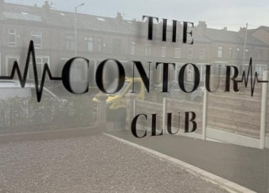 Window with The Contour Club Mcr logo in Bolton, England, GB.