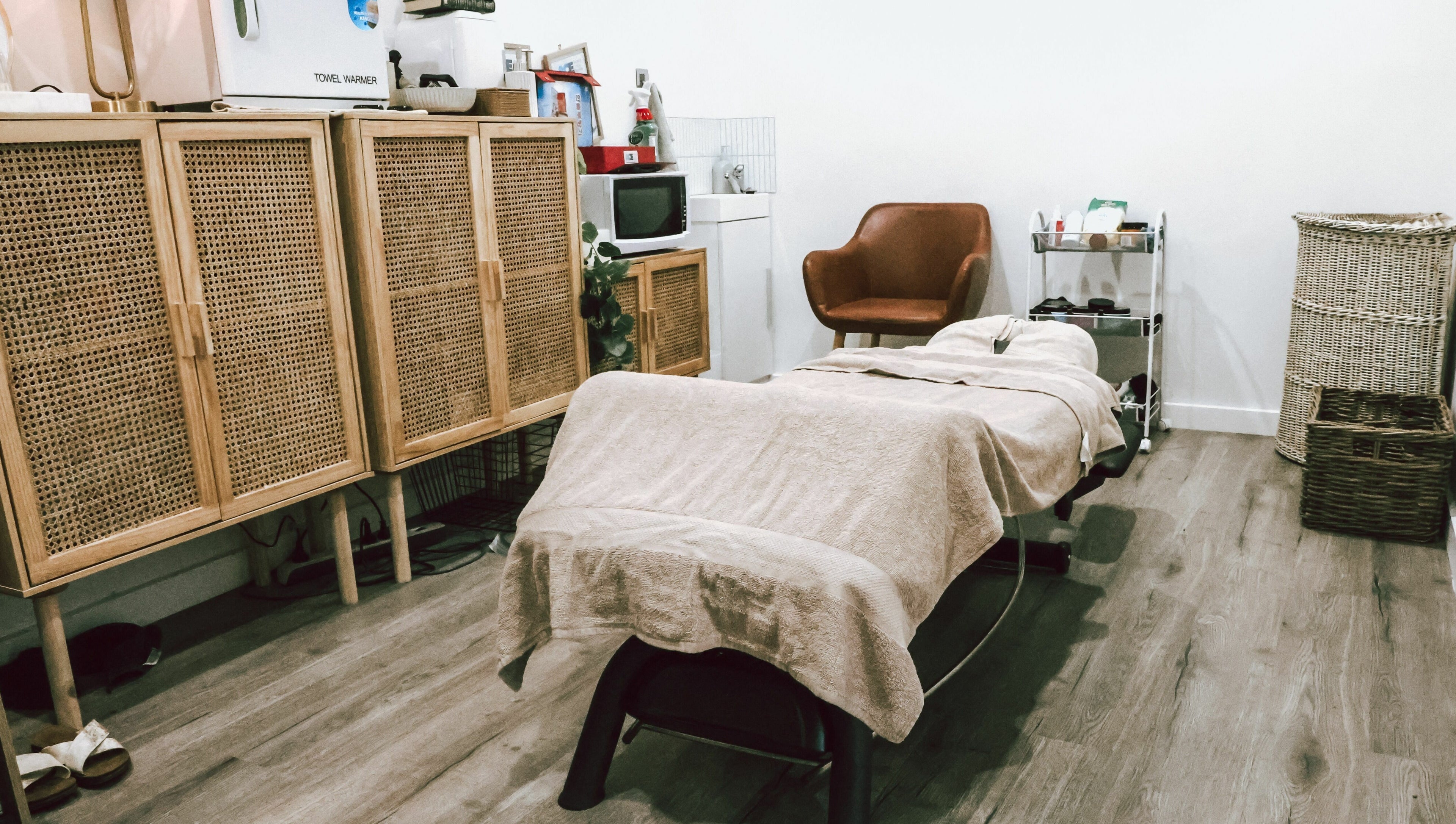Serene massage room at Sunday Ridge Remedial Massage, Simpson, Victoria, AU, showcasing a cozy treatment bed.