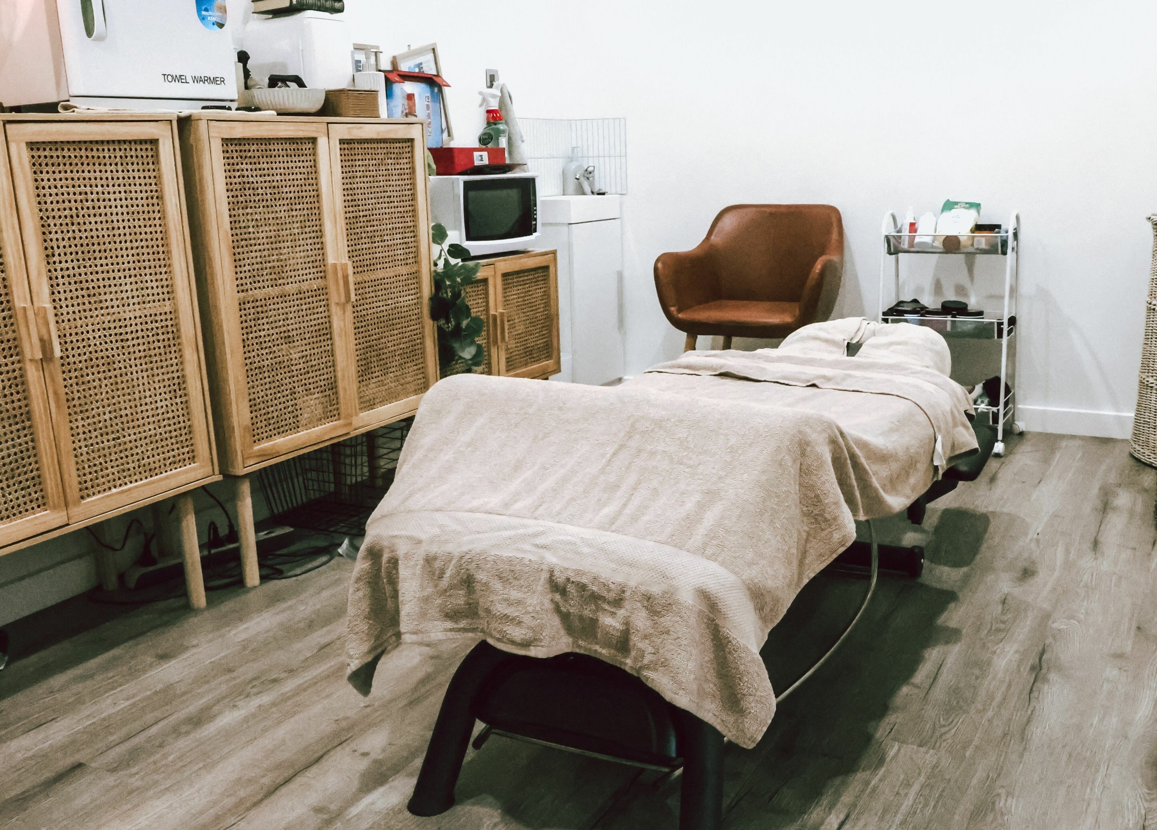 Serene massage room at Sunday Ridge Remedial Massage, Simpson, Victoria, AU, showcasing a cozy treatment bed.