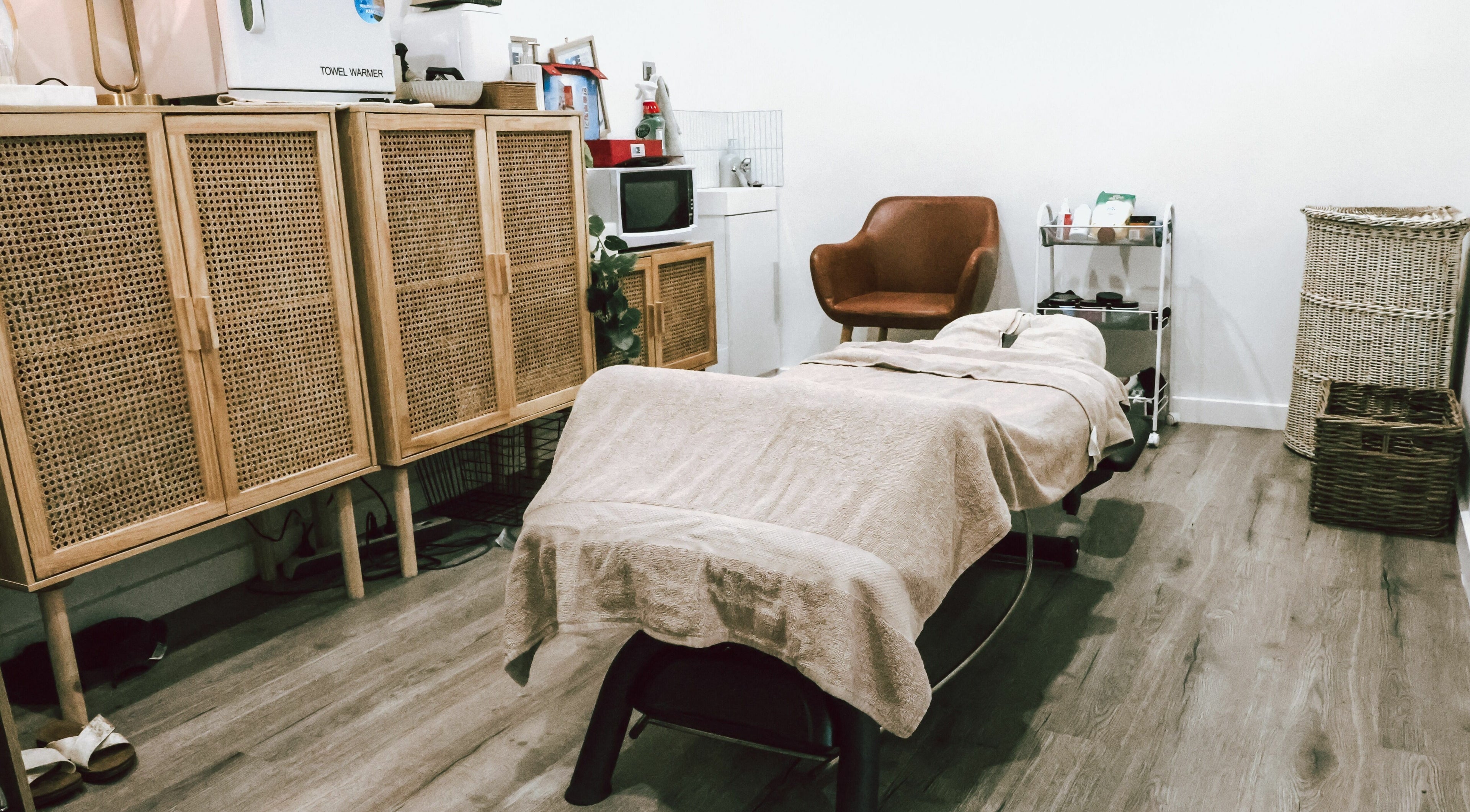 Serene massage room at Sunday Ridge Remedial Massage, Simpson, Victoria, AU, showcasing a cozy treatment bed.