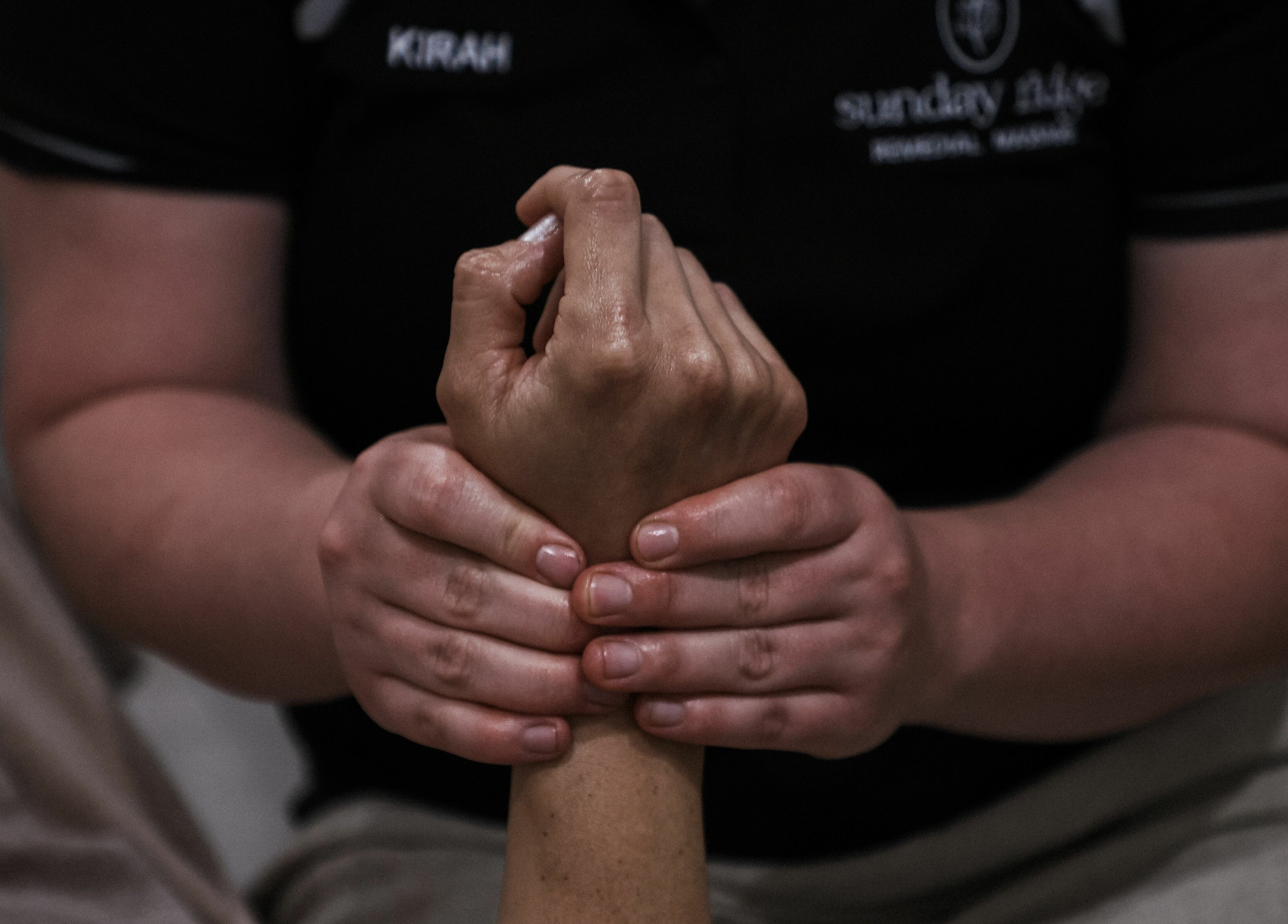 Therapist at Sunday Ridge Remedial Massage in Simpson, Victoria, AU performing a soothing hand massage.