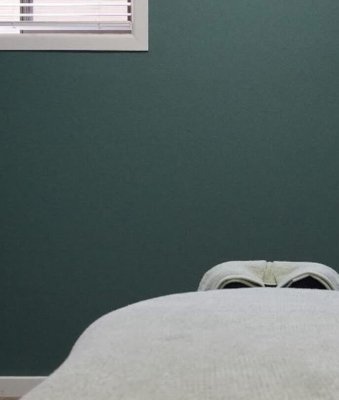 Tranquil massage room at Sunday Ridge Remedial in KINFOLK Colac, Colac, Victoria, AU with a comfortable massage table.