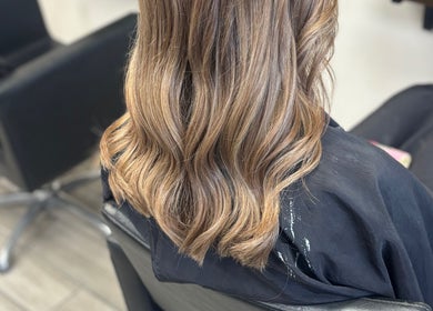 Stylish wavy hair styled at ALS Hair, Clonmel, County Tipperary, IE, showcasing expert hairdressing skills.