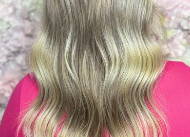 Flowing blonde hair styled in soft waves at ALS Hair, Clonmel, County Tipperary, IE.