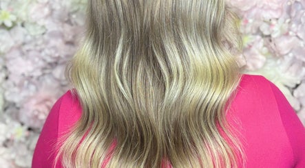 Flowing blonde hair styled in soft waves at ALS Hair, Clonmel, County Tipperary, IE.