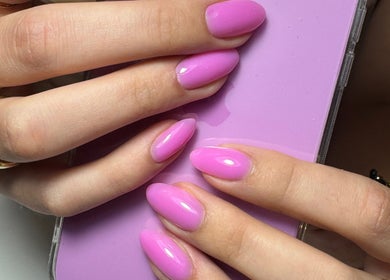 Bright pink manicured nails at Simmy & Co Nails in Melbourne, Victoria, AU highlighting glossy finish.