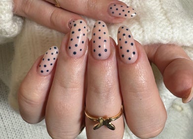 Stylish polka dot nails by Simmy & Co Nails, Melbourne, Victoria, AU, showcasing elegant manicure design.