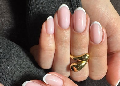 Elegant French manicure at Simmy & Co Nails, Melbourne, Victoria, AU showcasing polished hands.