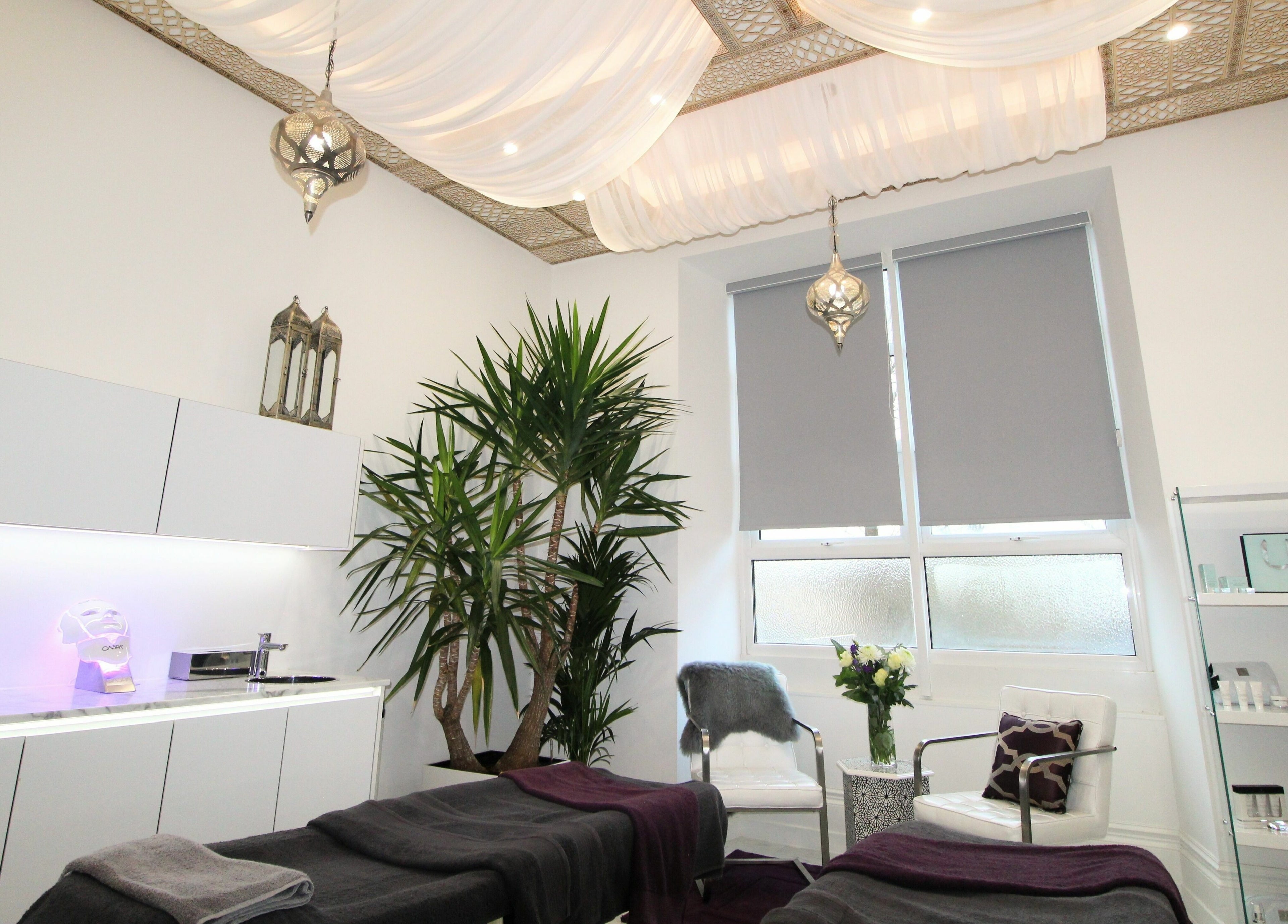 Luxurious treatment room at BeautiPhi Medispa, Colne, England, GB, featuring elegant decor and relaxing ambiance.
