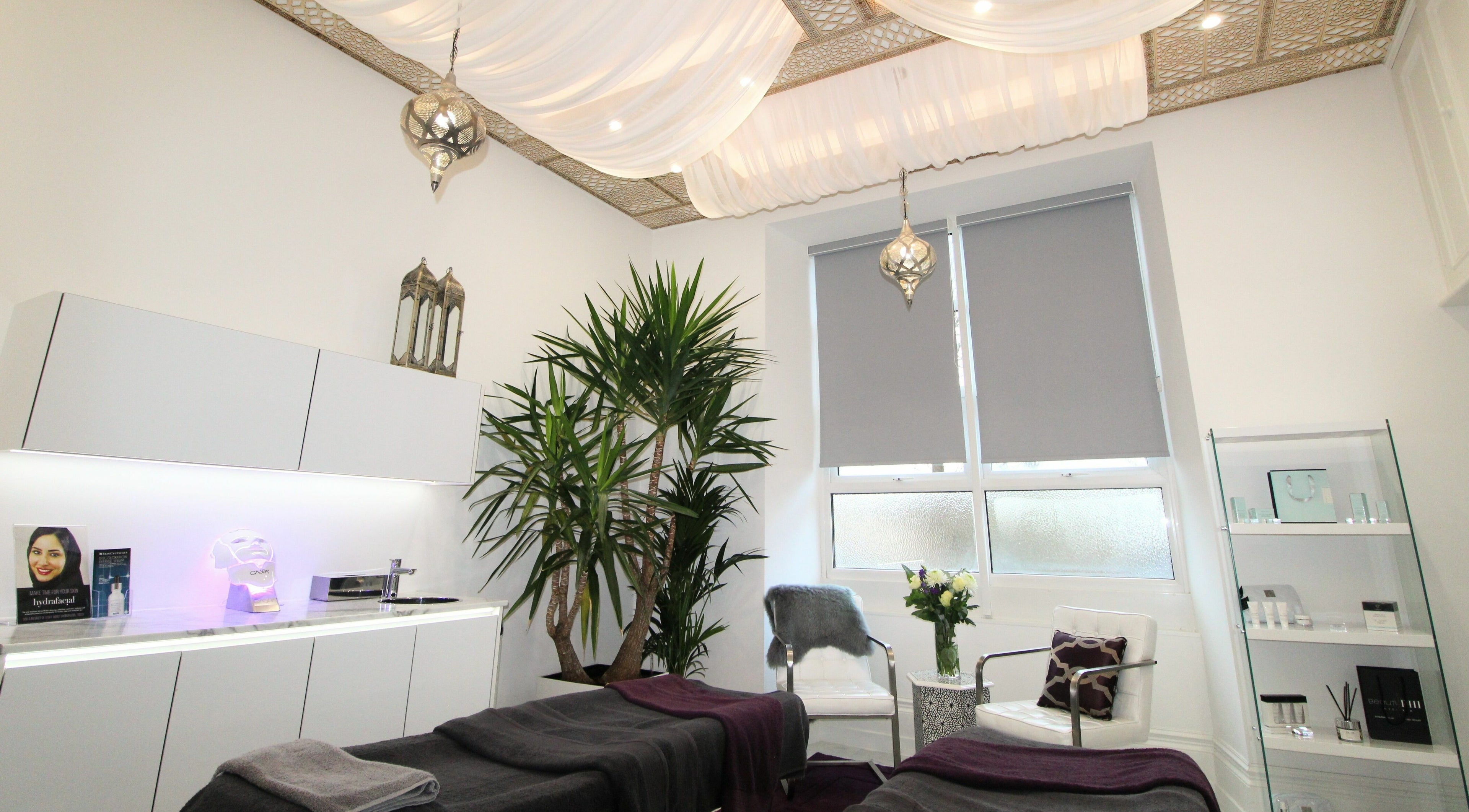 Luxurious treatment room at BeautiPhi Medispa, Colne, England, GB, featuring elegant decor and relaxing ambiance.