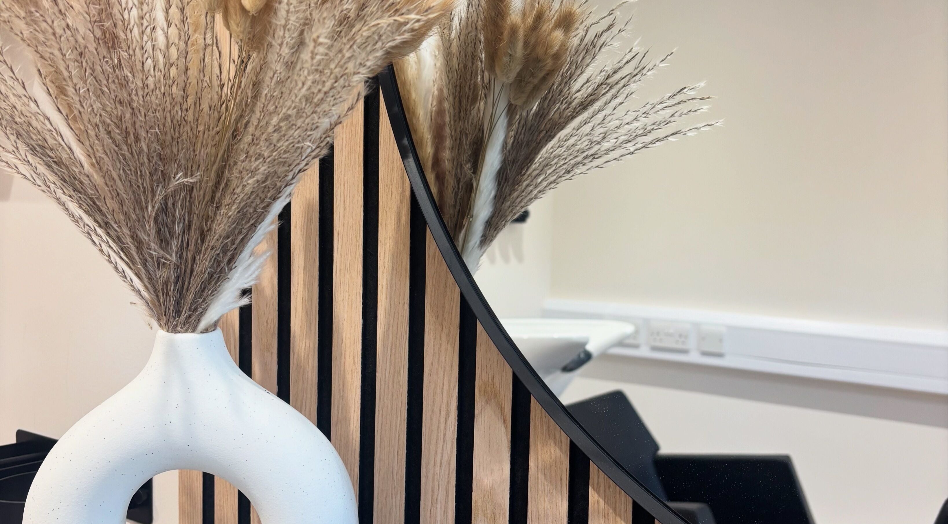 Decorative vase with dried grasses at Francesca’s Hair Hideaway, West End, England, GB.