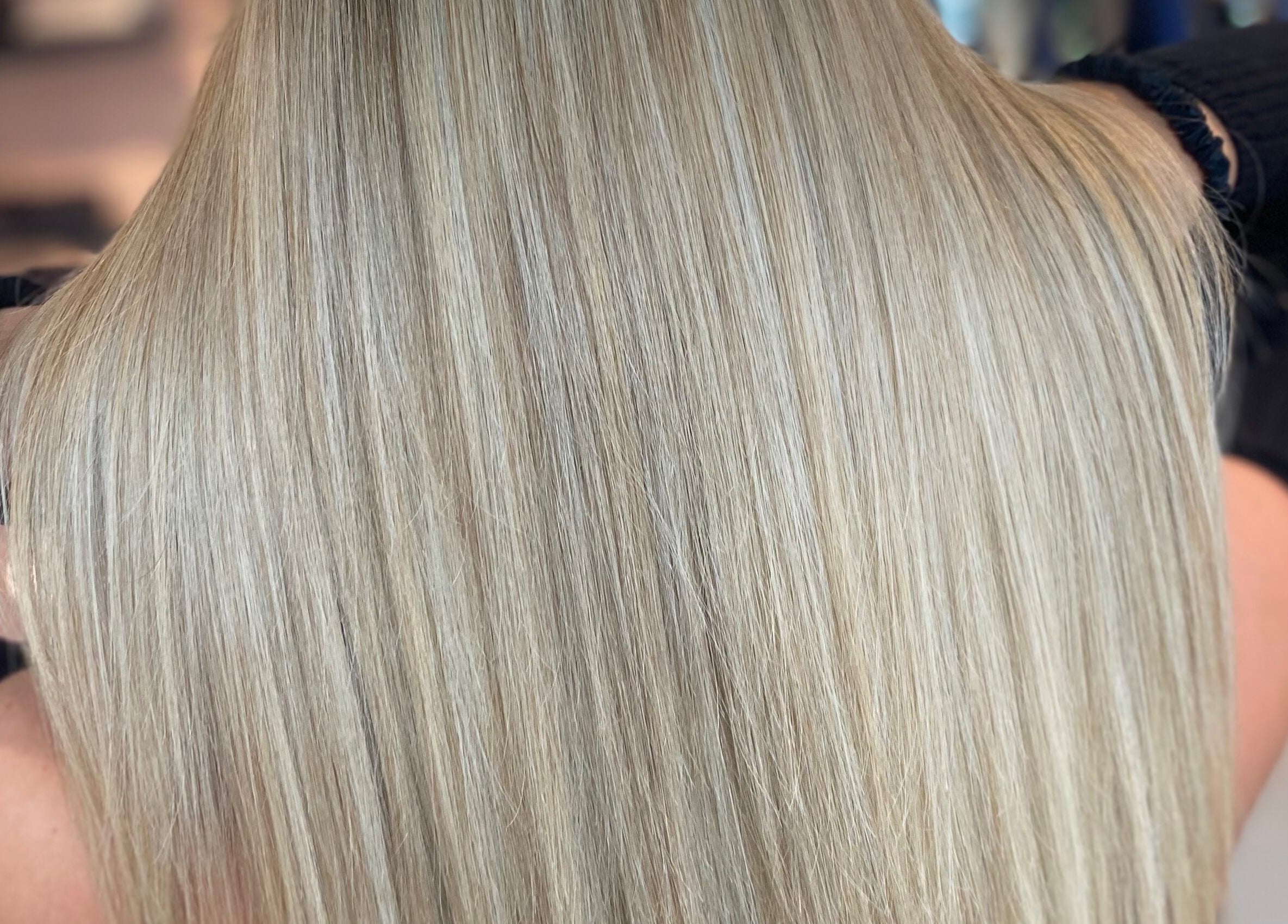Glossy blonde hair styled to perfection at Francesca’s Hair Hideaway, West end, England, GB.