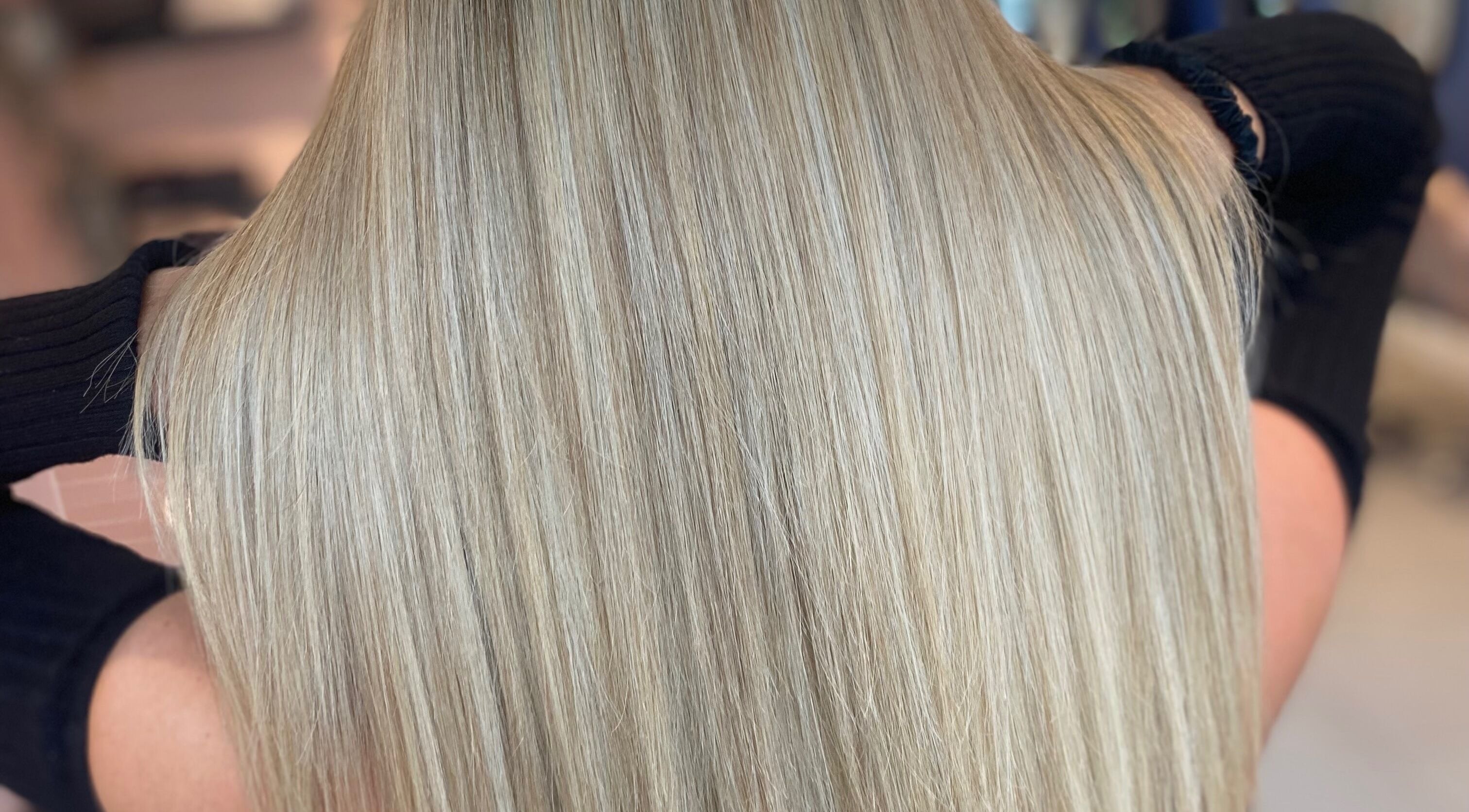 Glossy blonde hair styled to perfection at Francesca’s Hair Hideaway, West end, England, GB.