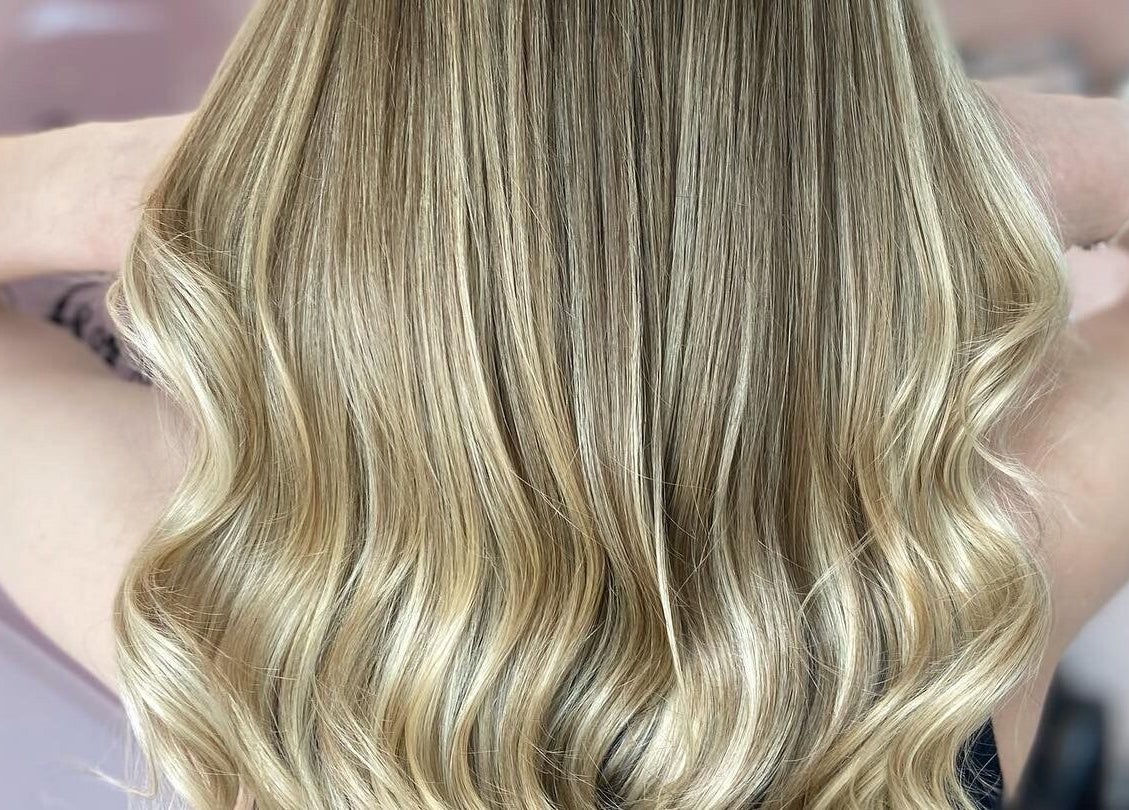 Blonde wavy hair styled at Francesca’s Hair Hideaway, West end, England, GB, showcasing expert styling.