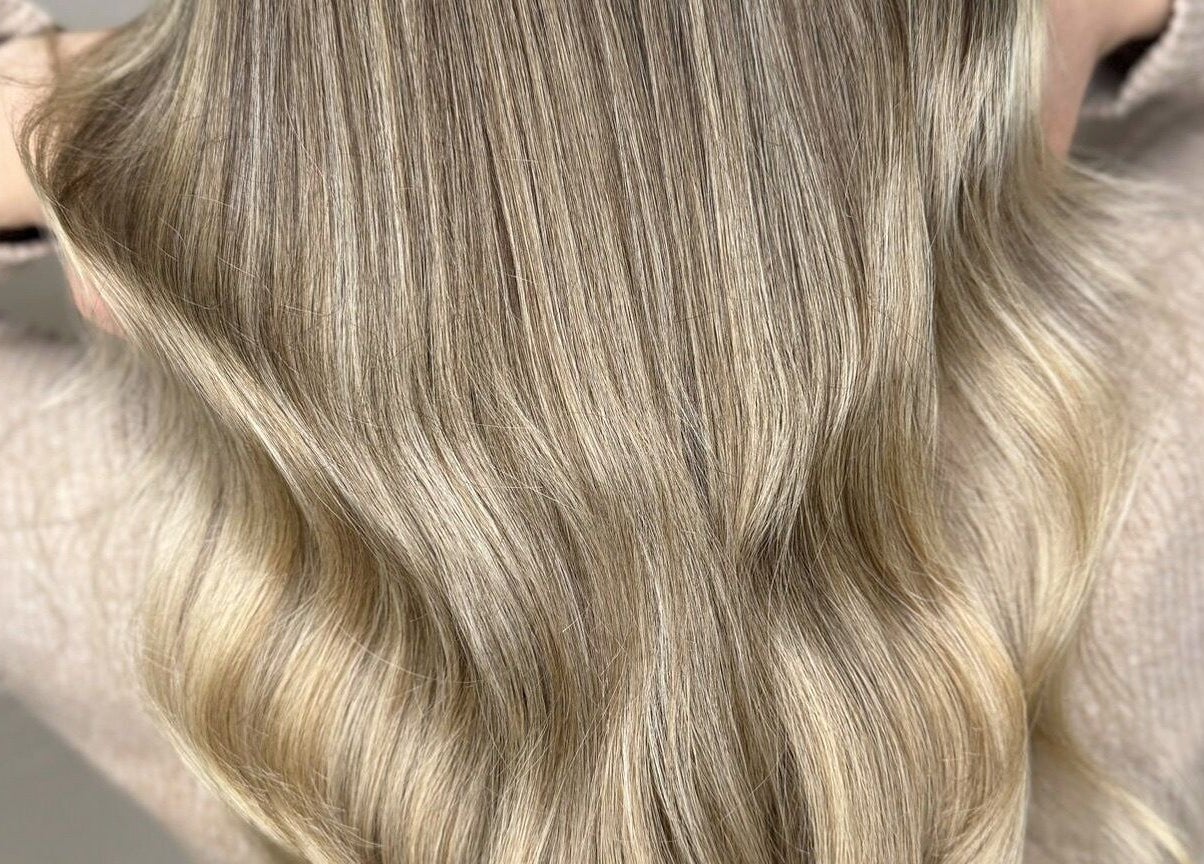 Blonde wavy hair styled at Francesca’s Hair Hideaway, West end, England, GB.