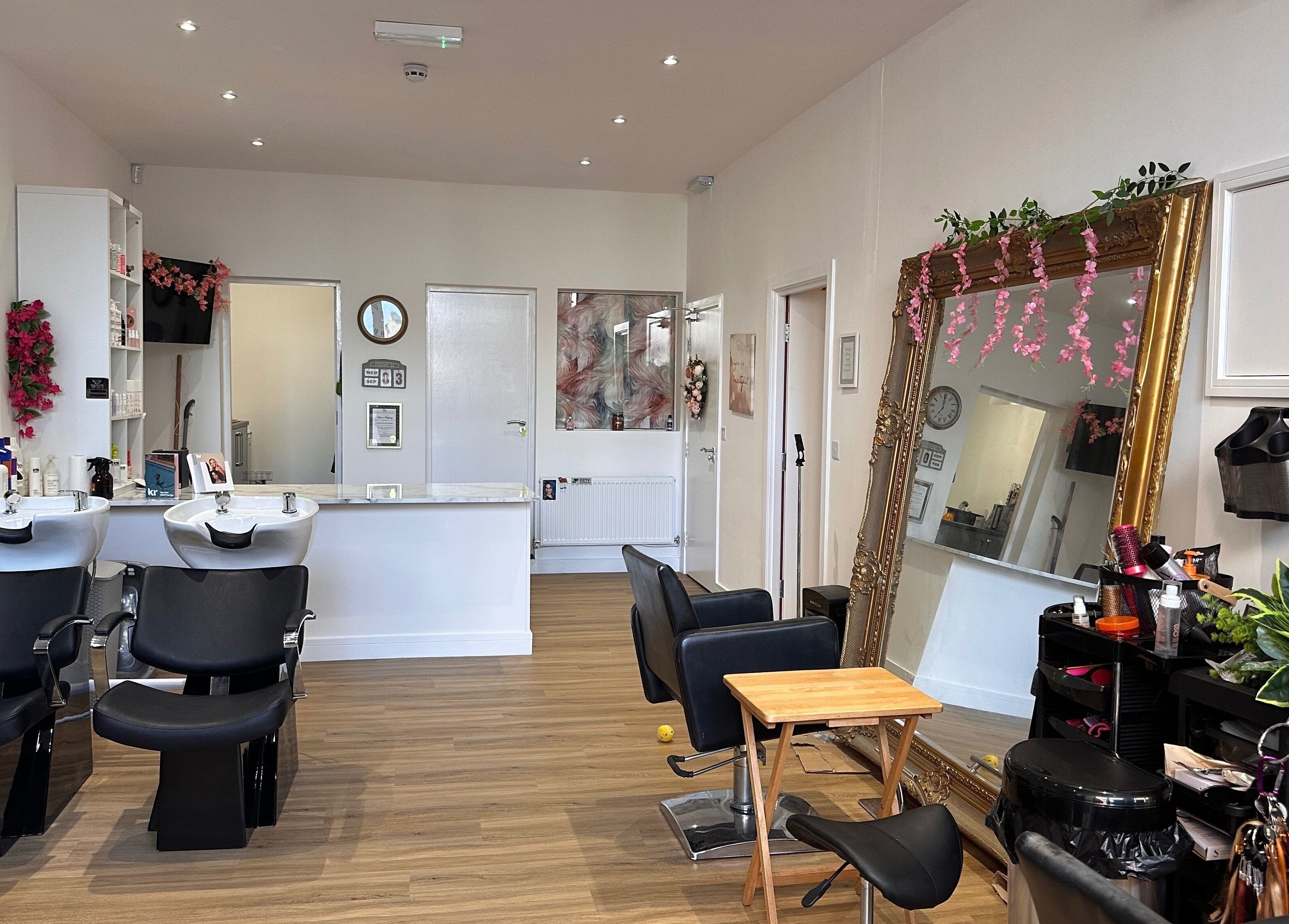 Chic interior of Envy Salon in Redcar, TS10 1AD, England, GB showcasing modern styling stations and decor.