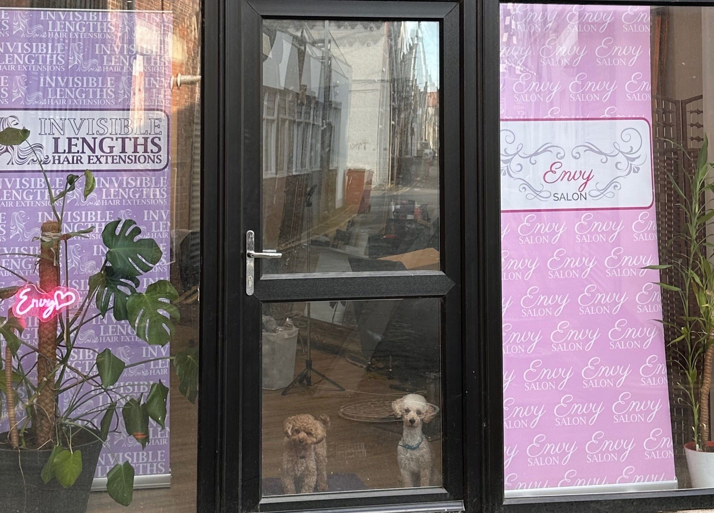 Entrance of Envy Salon, Redcar, TS10 1AD, England, GB with stylish signs and plants.