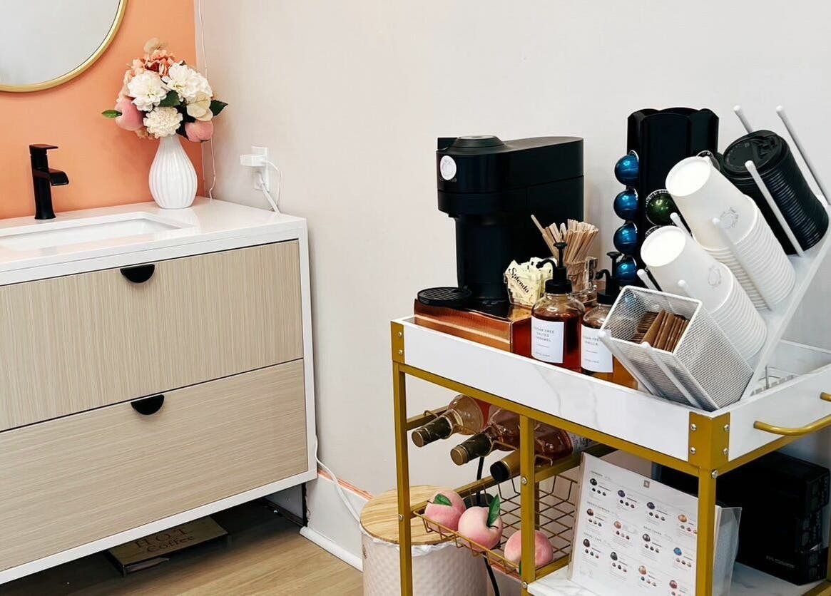 Chic vanity and coffee area at Peach Pit Beauty Hub in Waterloo, Ontario, CA.